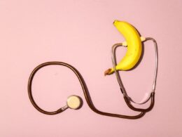 yellow banana and white earbuds